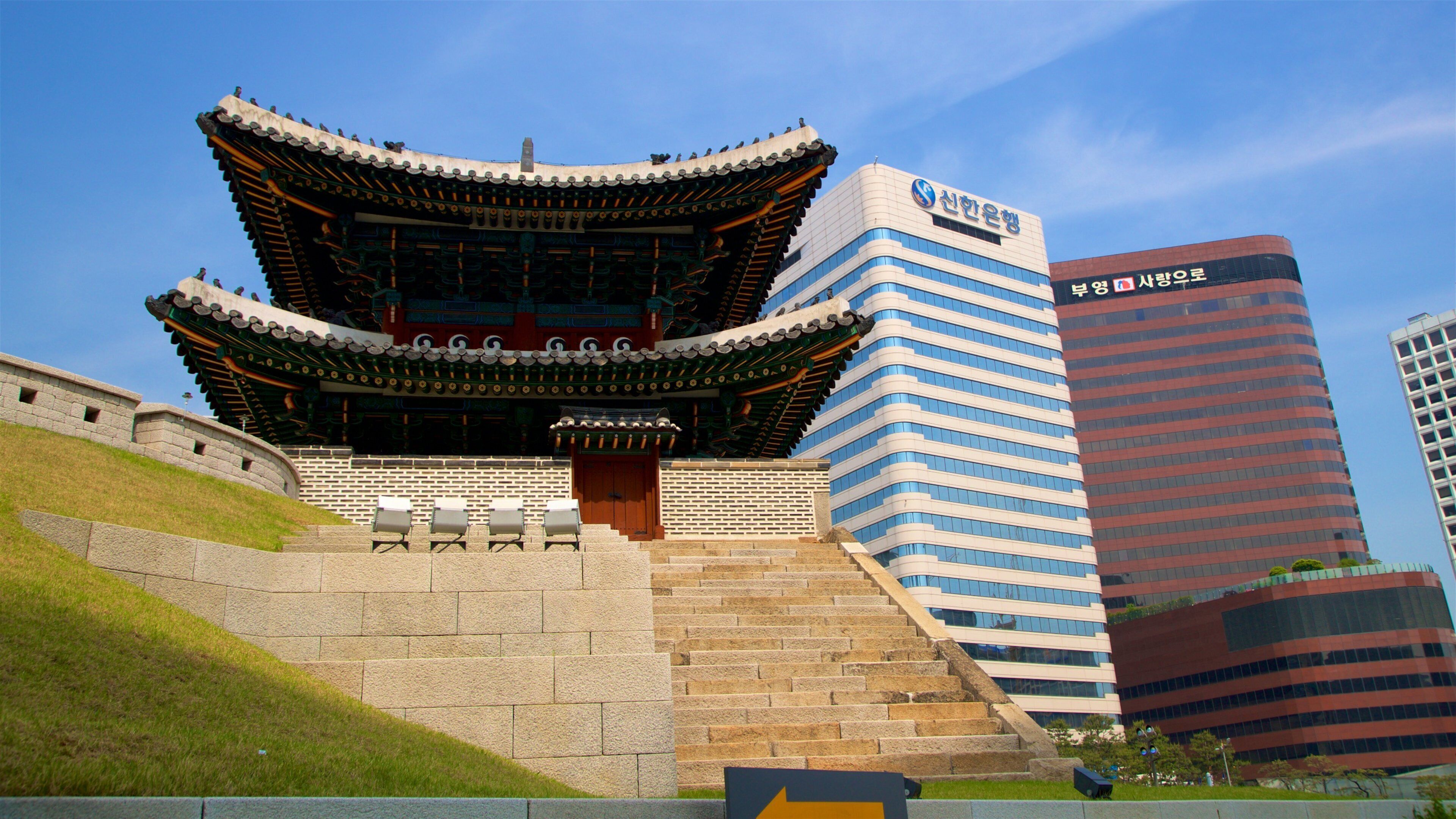 Sungnyemun Gate which includes a city, heritage architecture and a high-rise building