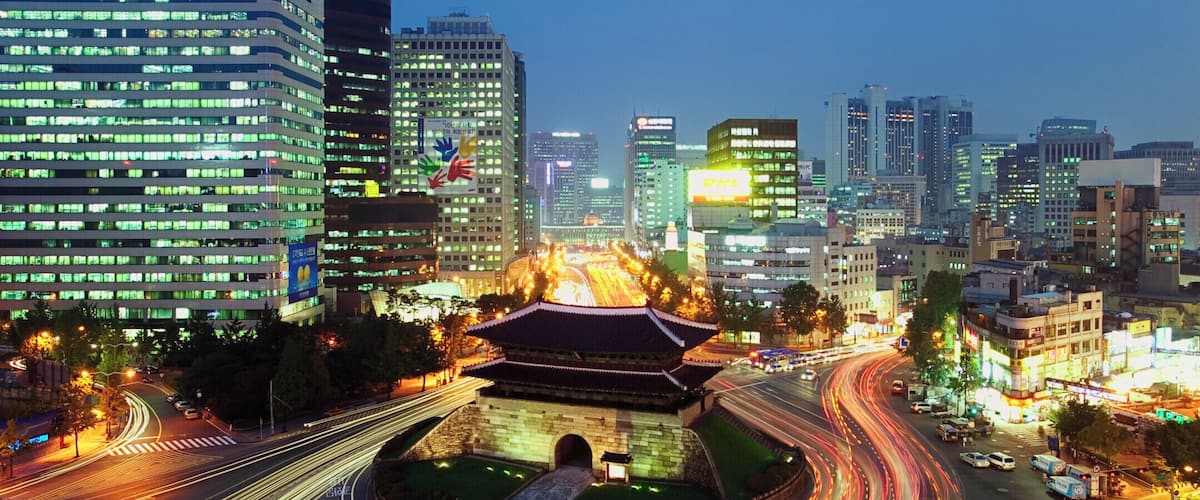 South Korea, Seoul, Namdaemun Gate and traffic, dusk, elevated view