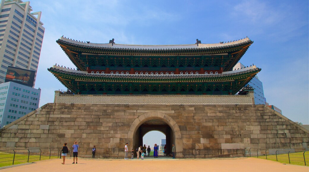 Sungnyemun Gate which includes heritage architecture as well as a small group of people