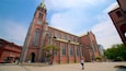 Myeongdong Cathedral featuring heritage architecture and a church or cathedral as well as an individual male