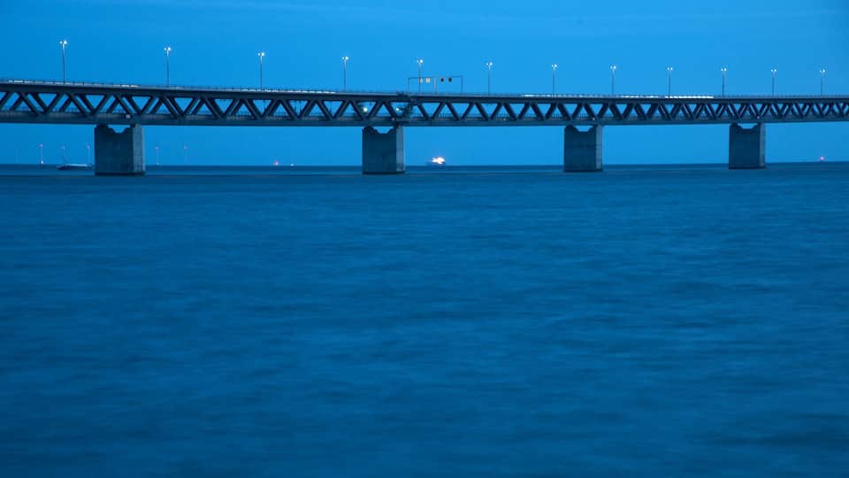 Oresund Bridge showing night scenes, a suspension bridge or treetop walkway and general coastal views