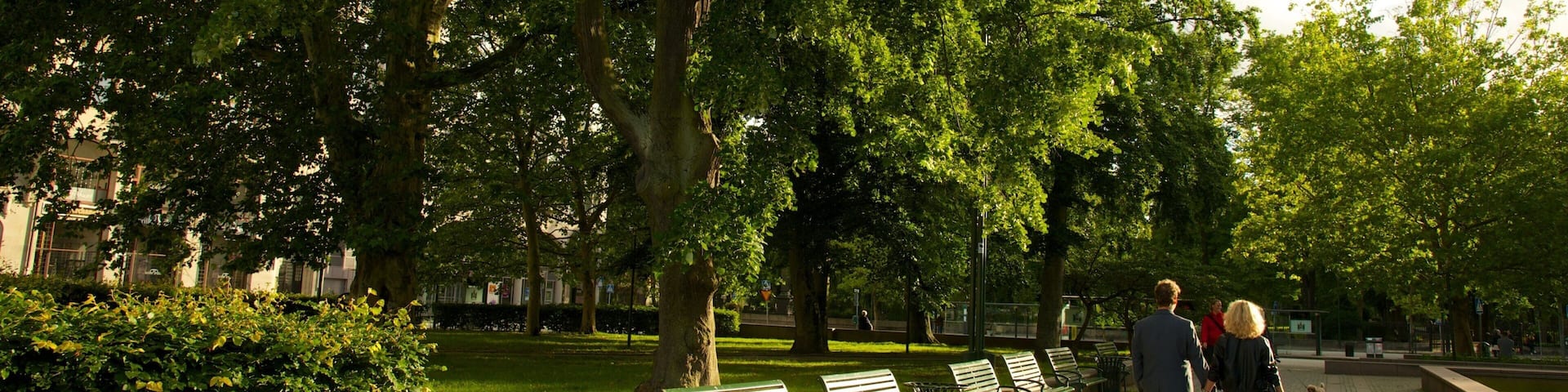Gustav Adolf Square featuring a garden as well as a couple