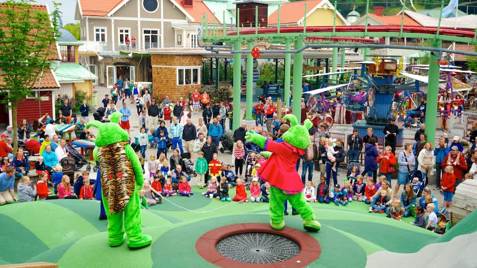 Liseberg Amusement Park which includes performance art and rides as well as a large group of people