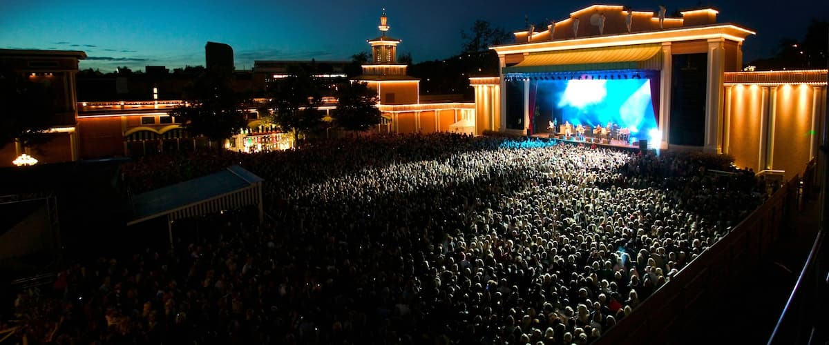 Liseberg Amusement Park featuring rides, performance art and theatre scenes