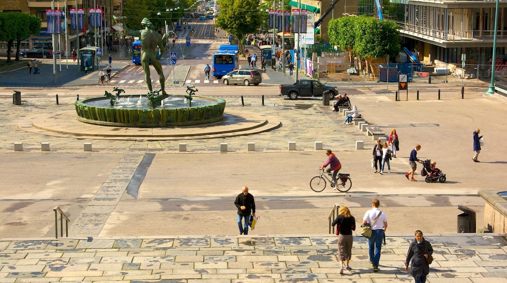 Poseidon-statuen som viser fjell, torg eller plass og by