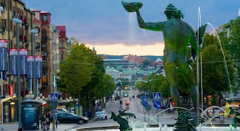 Poseidon Statue which includes a city, a fountain and street scenes