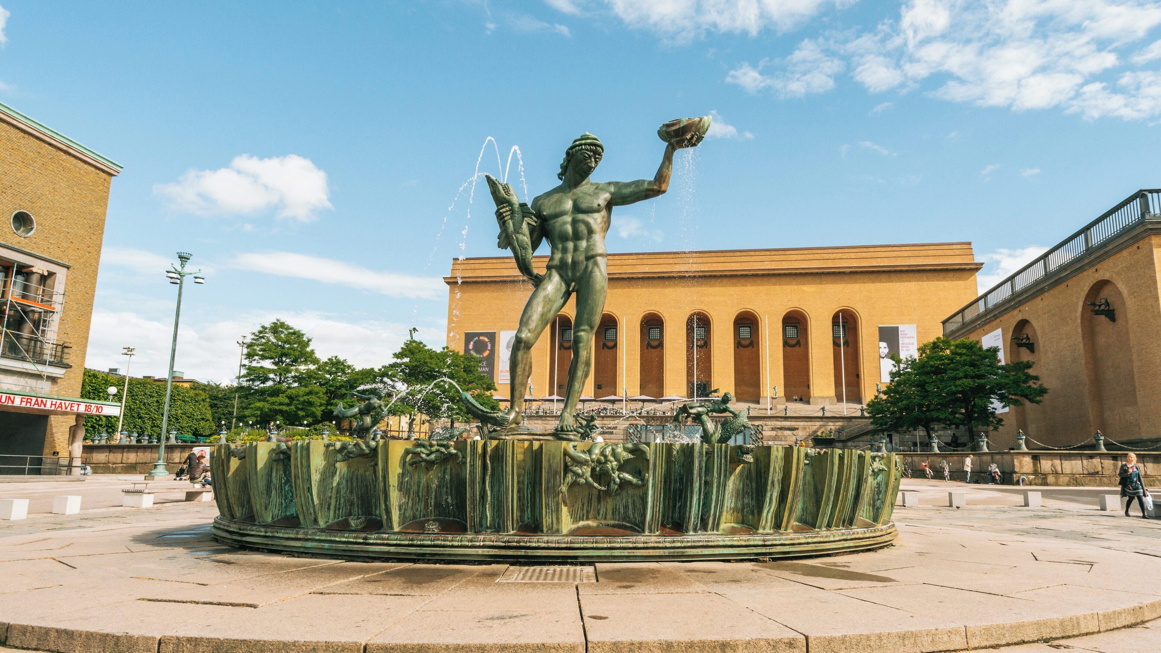 Poseidon statue stands majestically at Lorensberg, Gothenburg, showcasing stunning craftsmanship amidst cultural landmarks