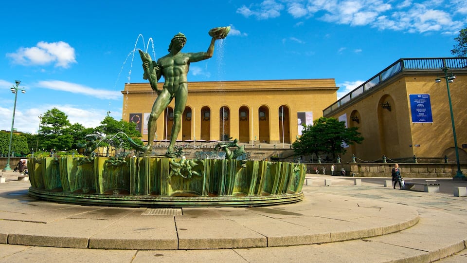 Poseidon Statue which includes a square or plaza, a statue or sculpture and a fountain