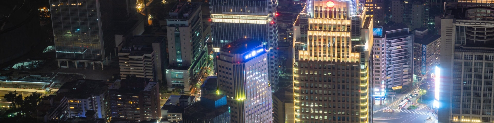 Taipei 101 showing a city, night scenes and a skyscraper