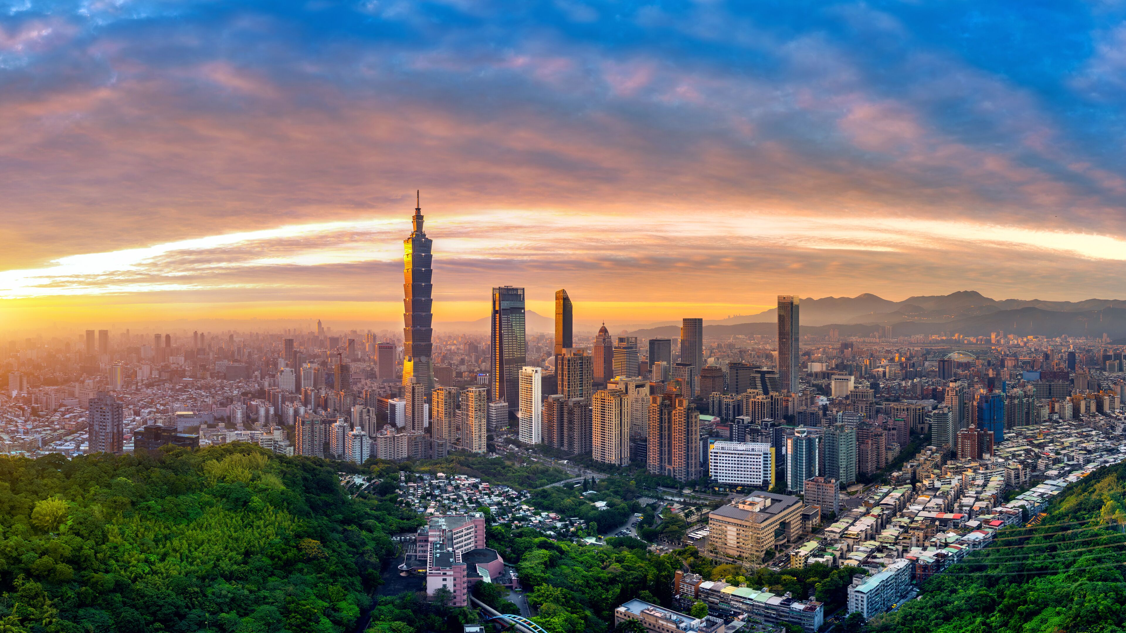 Panorama of Taipei cityscape at sunset in Taiwan.