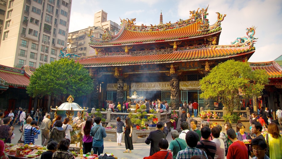 Longshan Temple which includes a temple or place of worship, religious elements and a city