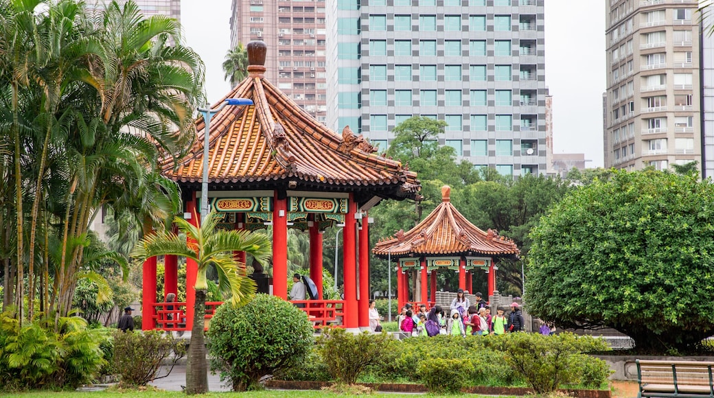 Taipei 228 Memorial Park featuring heritage elements and a park as well as a small group of people