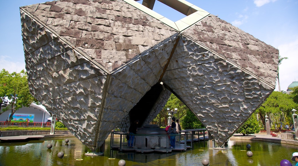Taipei 228 Memorial Park showing a garden, outdoor art and a pond