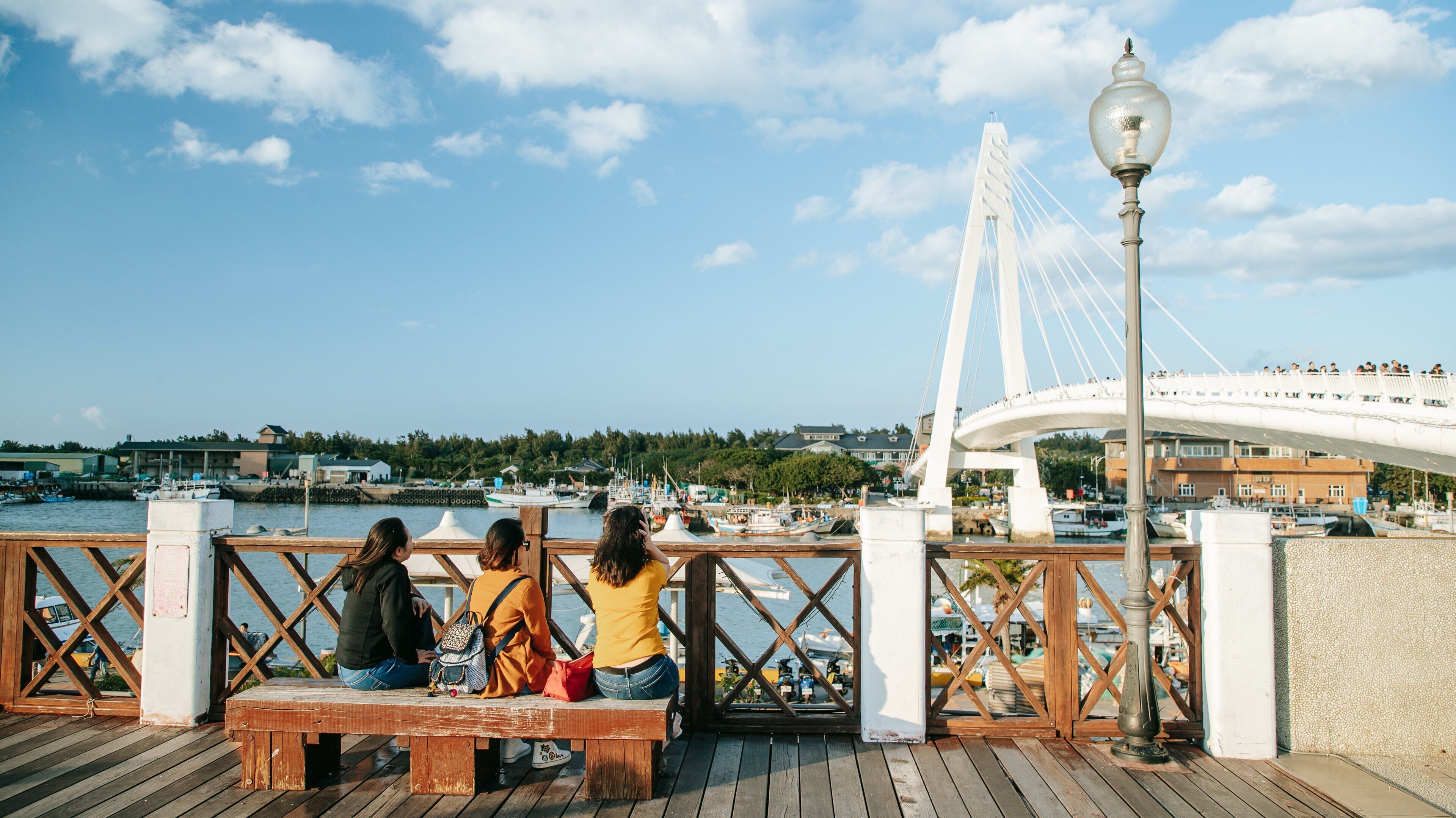 Tamsui Fisherman\'s Wharf showing views and a bay or harbor as well as a small group of people