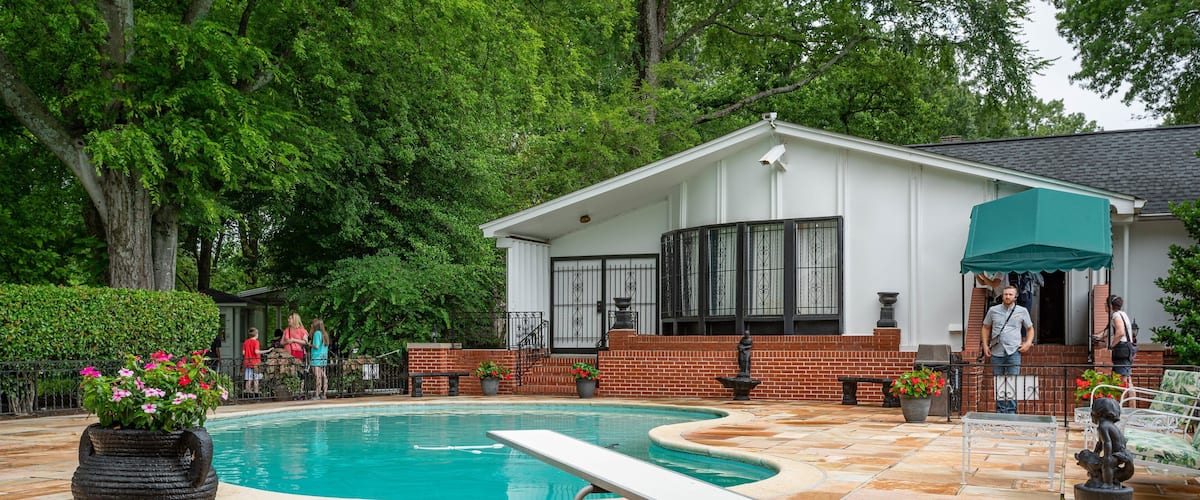 Graceland showing a house and a pool