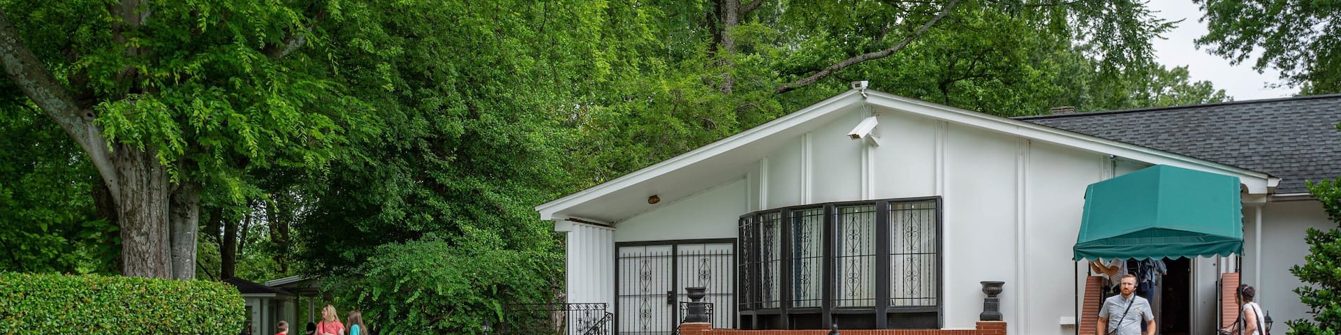 Graceland showing a house and a pool