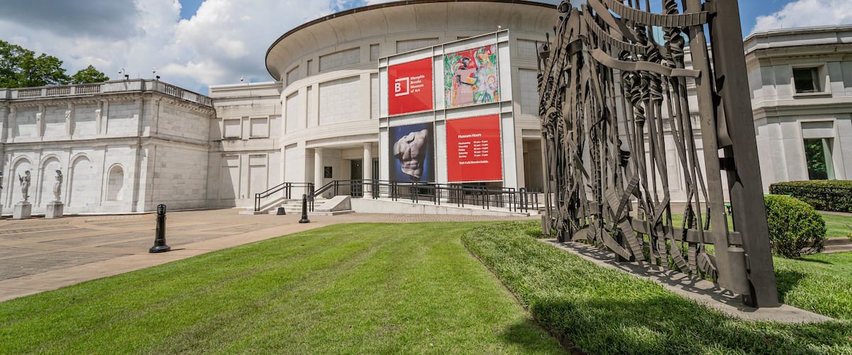 Memphis Brooks Museum of Art featuring signage and outdoor art