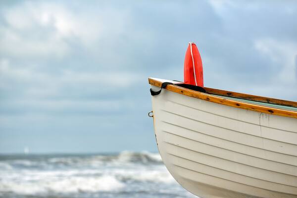 Life saving heat inside a wooden beach patrol boat on the beach
