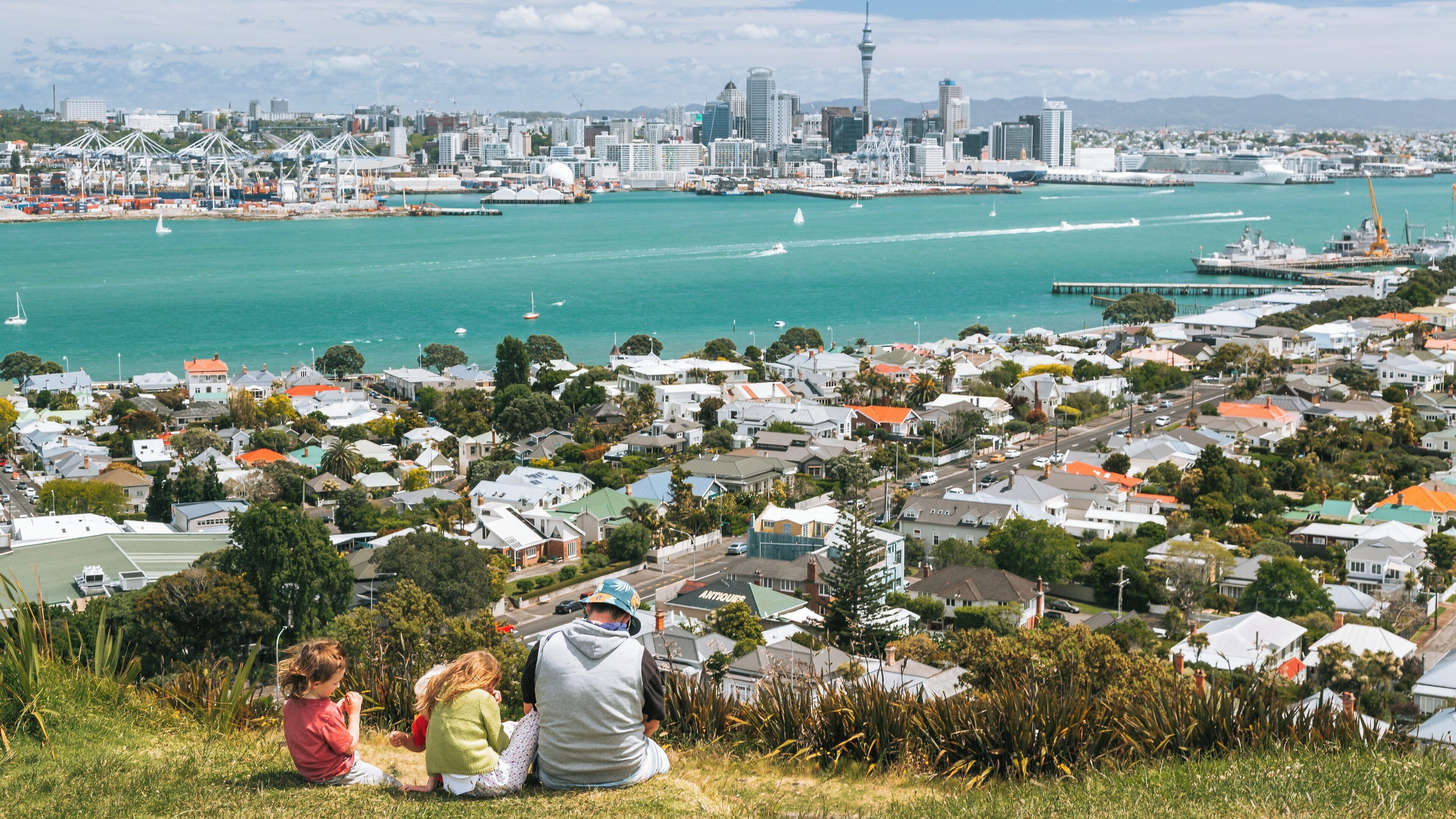 Enjoying the panoramic views from Mount Victoria in Devonport, showcasing Auckland's skyline and bustling harbor life