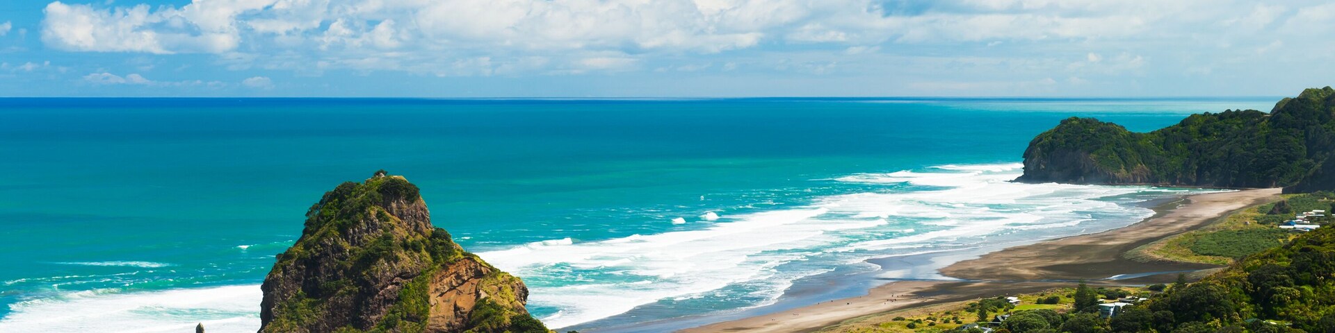 Beautiful Piha beach near Auckland with a mighty Lion Rock, New Zealand