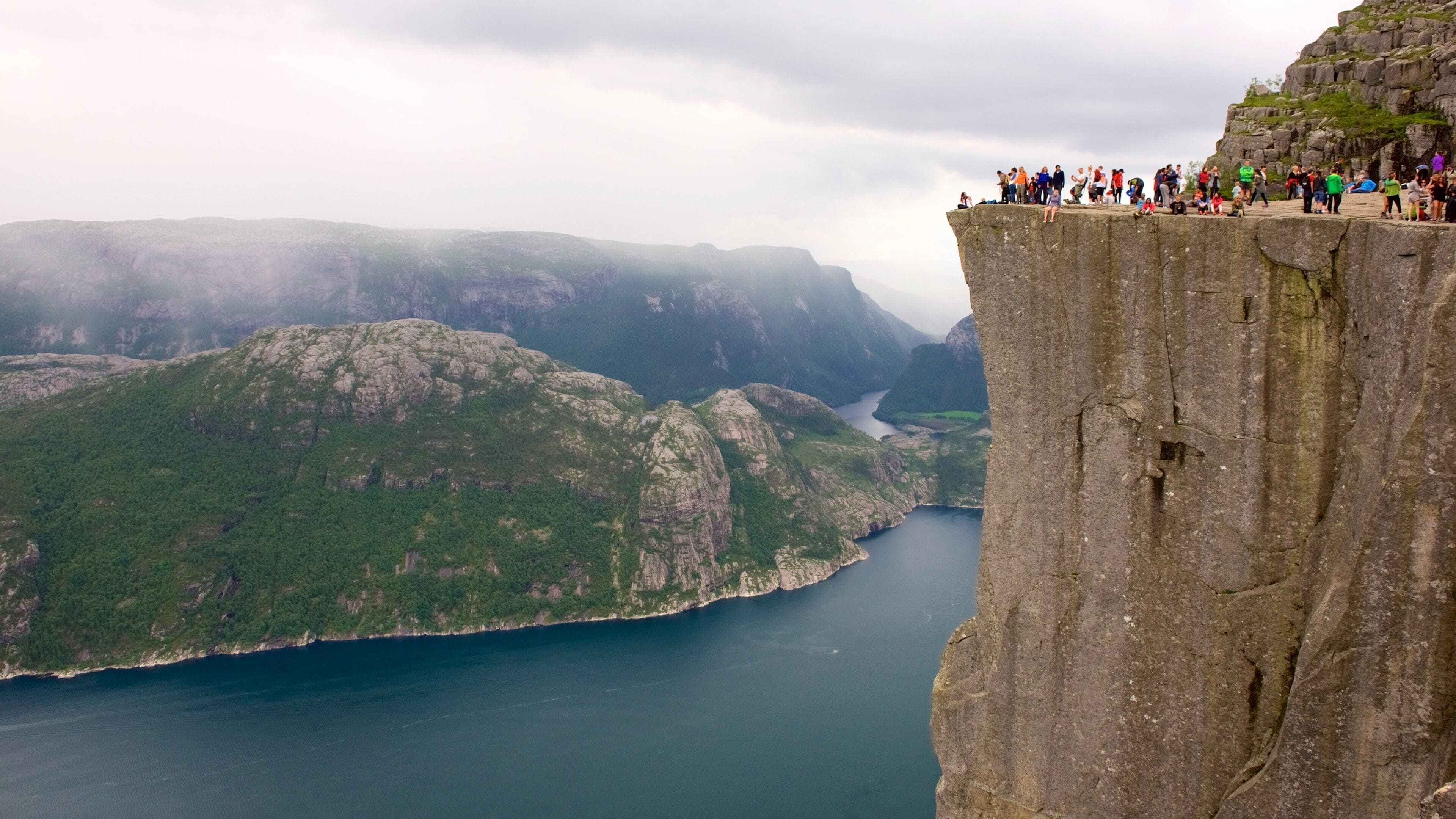 Preikestolen featuring a lake or waterhole, mountains and views