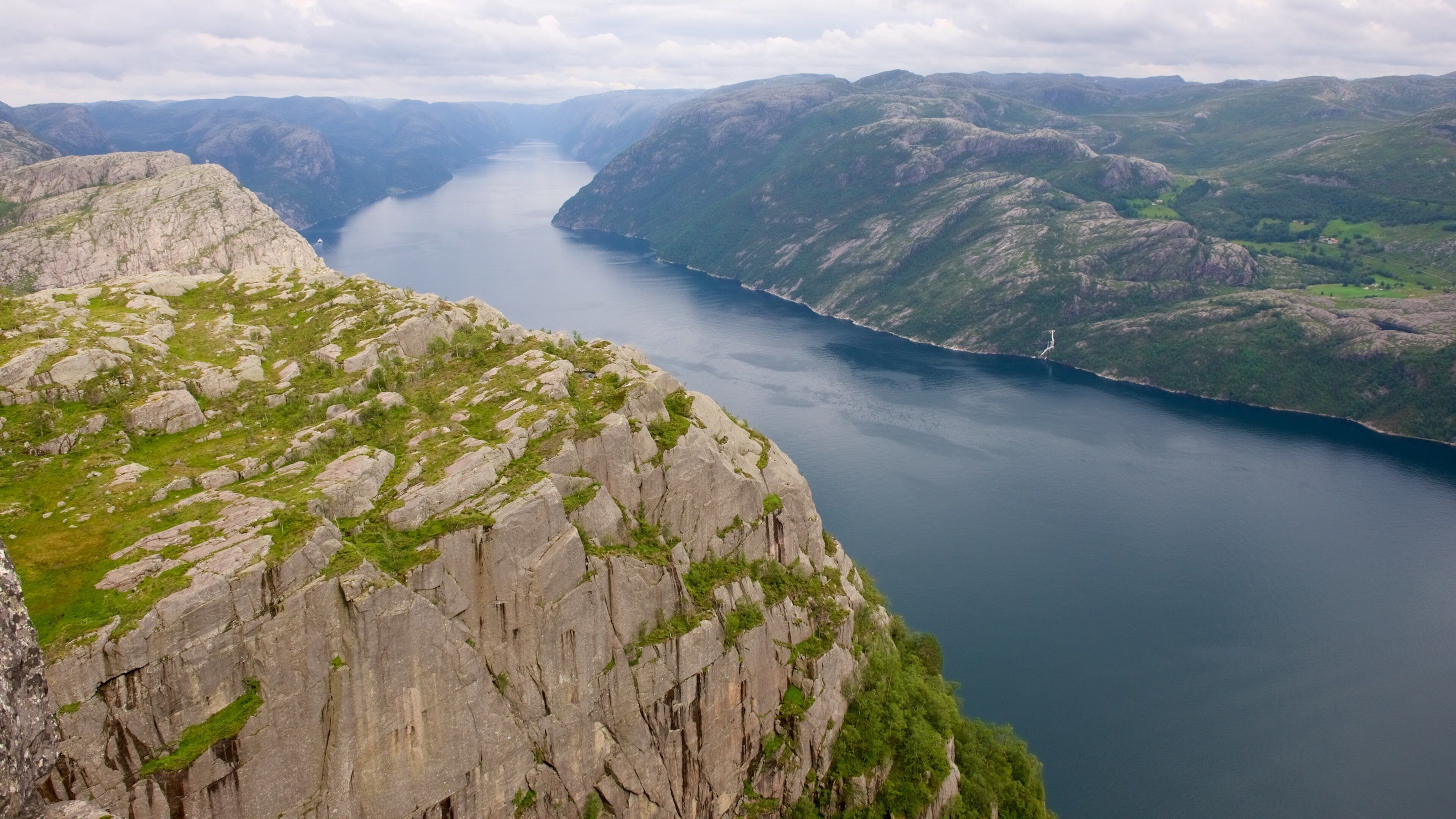 Preikestolen featuring a lake or waterhole, landscape views and mountains