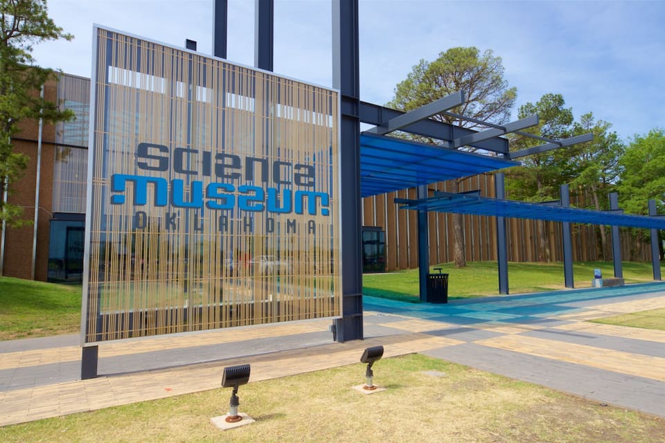 A modern building with a large sign reading "Science Museum Oklahoma."