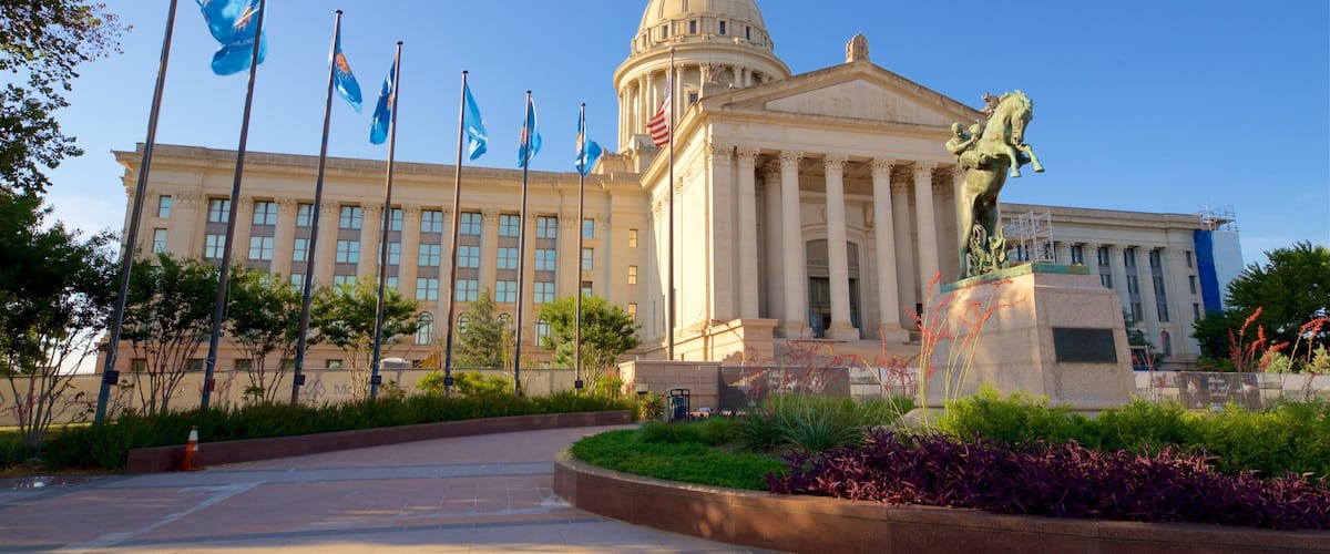 Oklahoma State Capitol featuring modern architecture, a statue or sculpture and a park