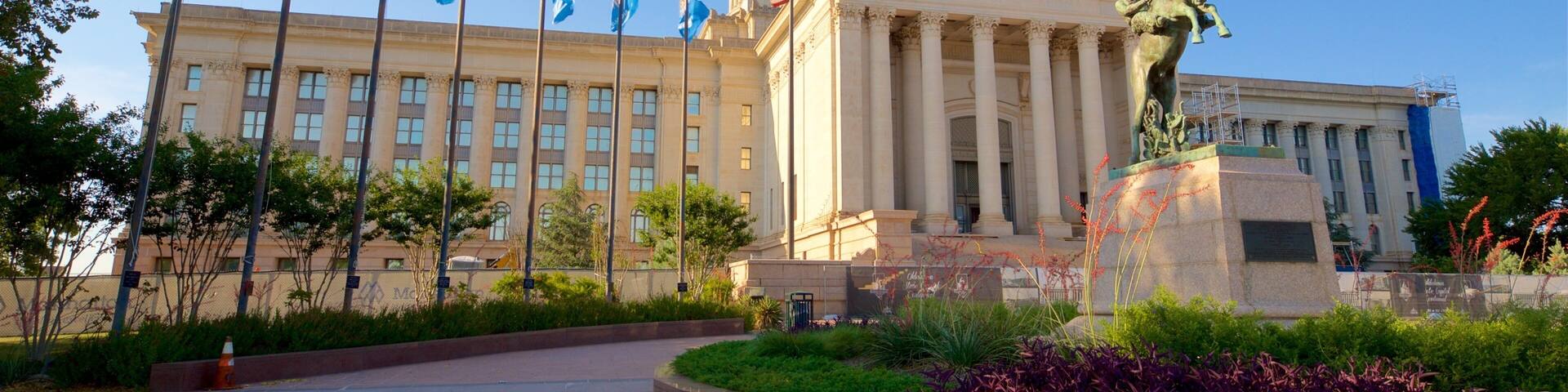 Oklahoma State Capitol showing a park, modern architecture and a statue or sculpture