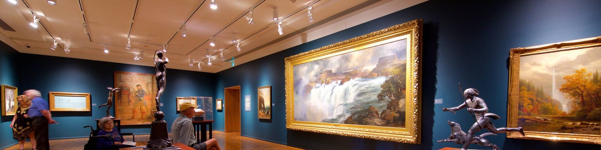 Gilcrease Museum featuring interior views and art as well as a small group of people