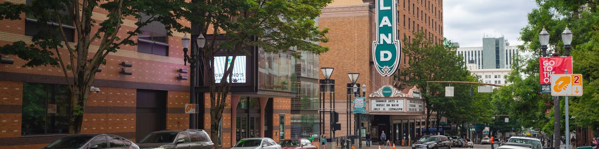 Arlene Schnitzer Concert Hall showing a city and signage
