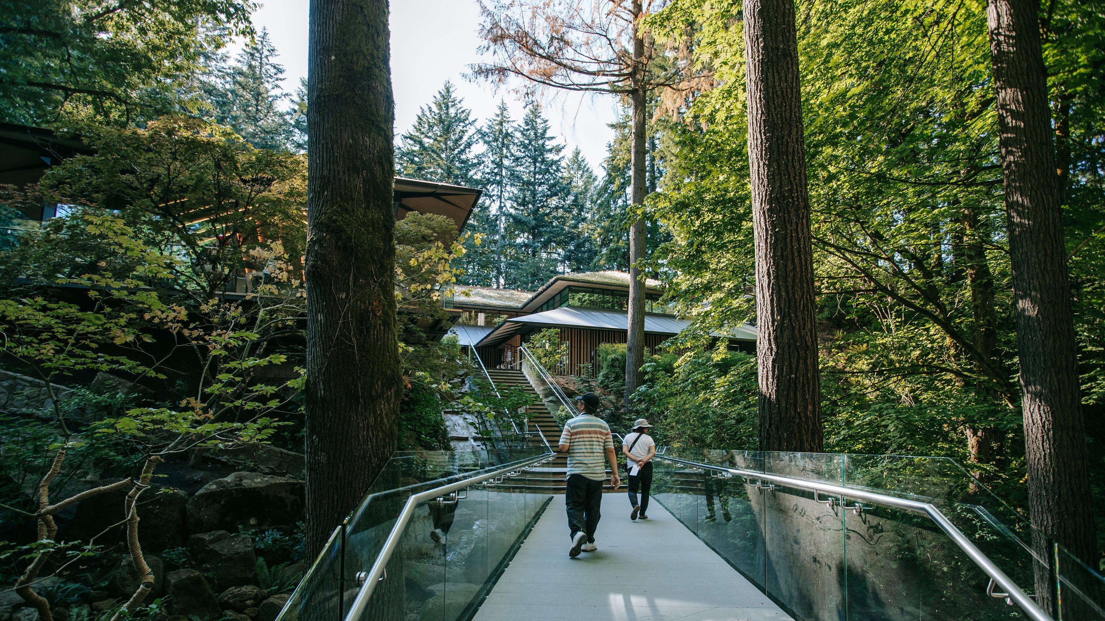 Portland Japanese Garden featuring a bridge, a garden and forest scenes