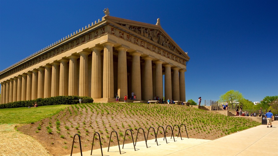 A large classical building with tall columns and a detailed frieze.
