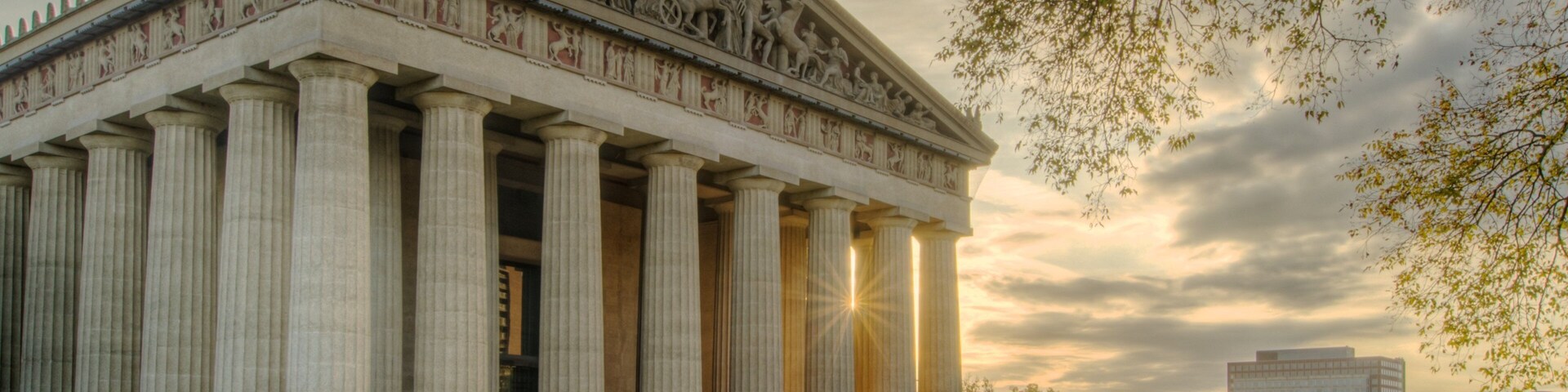 Parthenon replica in Nashville showcases ancient Greek architecture amidst a modern city backdrop
