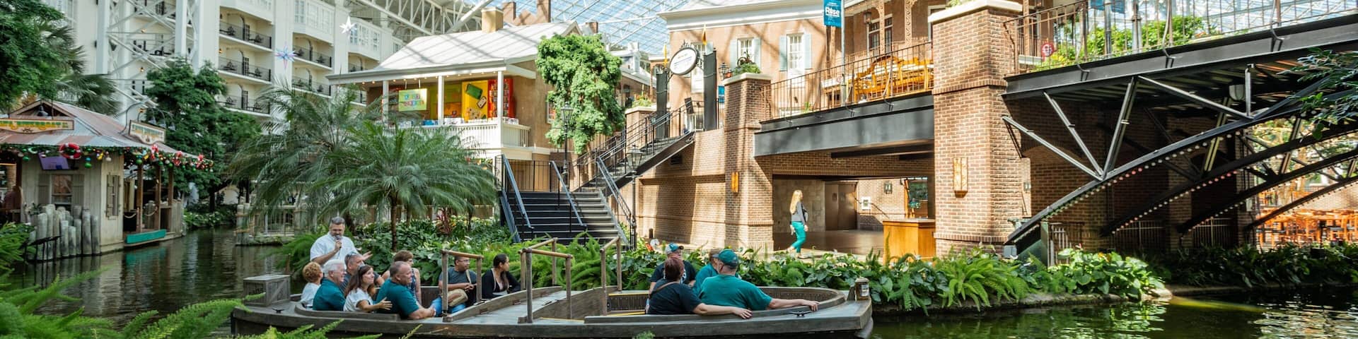 Opryland Hotel Gardens which includes a river or creek, interior views and boating