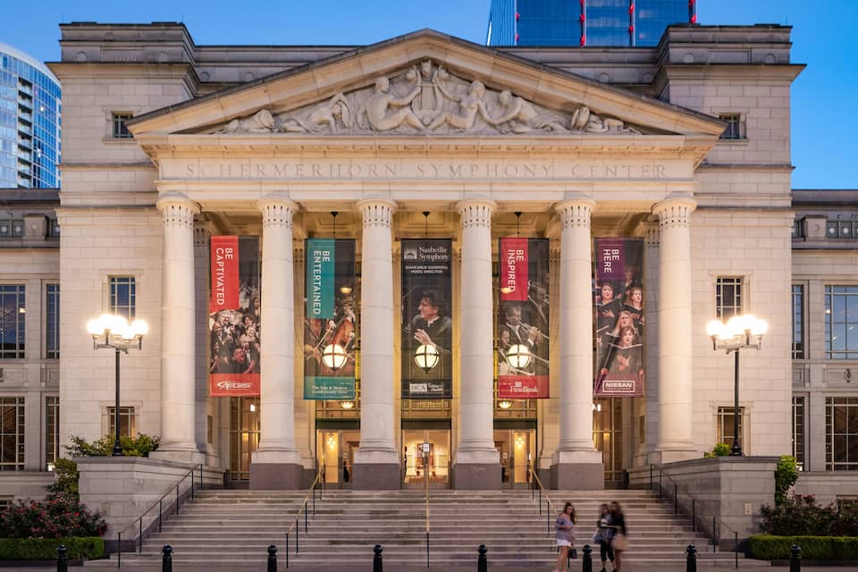 The Schermerhorn Symphony Center with classical architecture, columns, and banners.