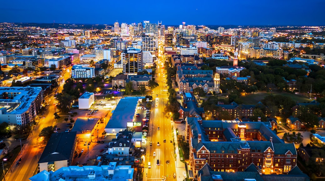Nashville skyline at night, looking down Broadway, with Vanderbilt in foreground.