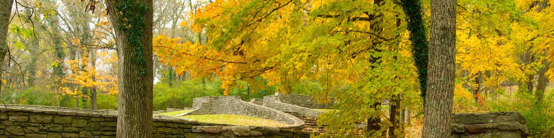 Scenic autumn landscape at Edwin and Percy Warner Parks in Nashville, Tennessee featuring stone bridge and colorful foliage