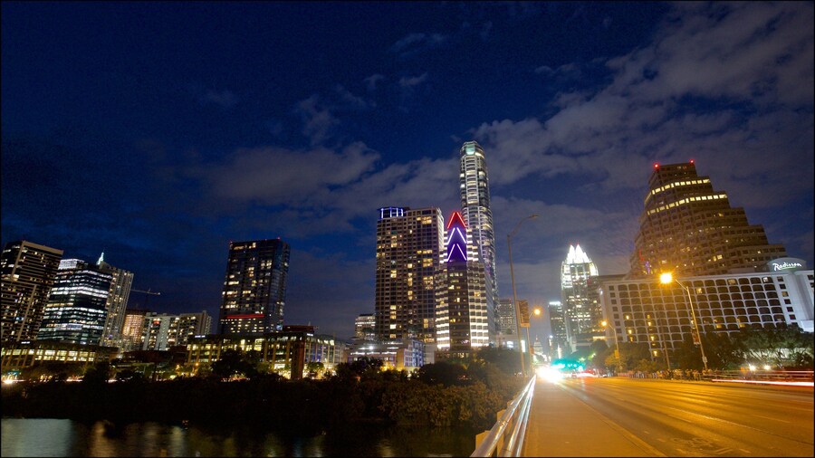 Ann W. Richards Congress Avenue Bridge showing a city and night scenes