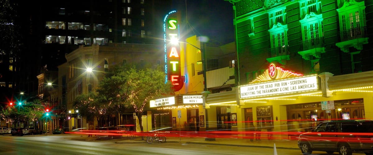Nighttime view of Paramount Theatre illuminating downtown Austin, showcasing local culture and vibrant nightlife