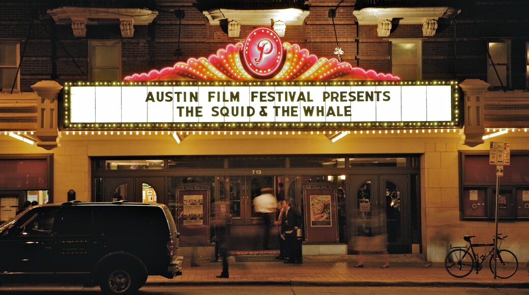 Paramount Theater featuring theater scenes, night scenes and signage