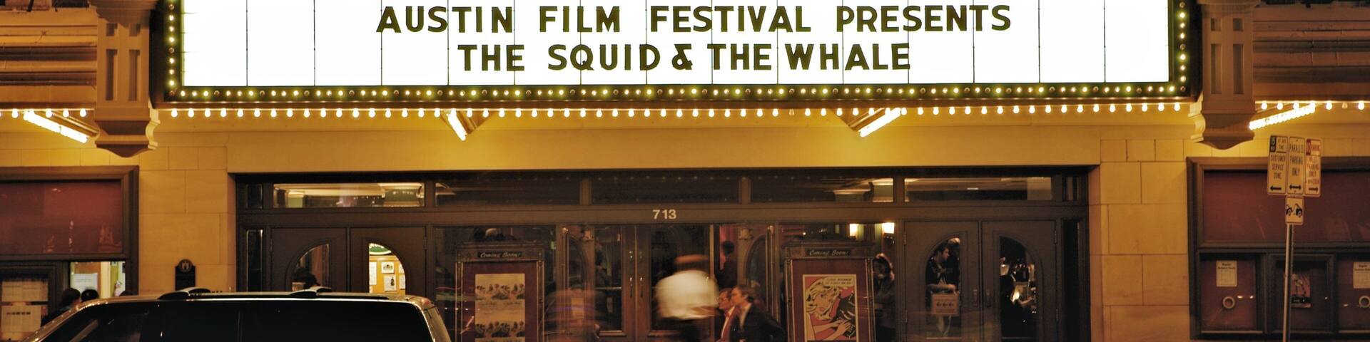 A theater marquee advertising the Austin Film Festival's presentation of 'The Squid & The Whale'.