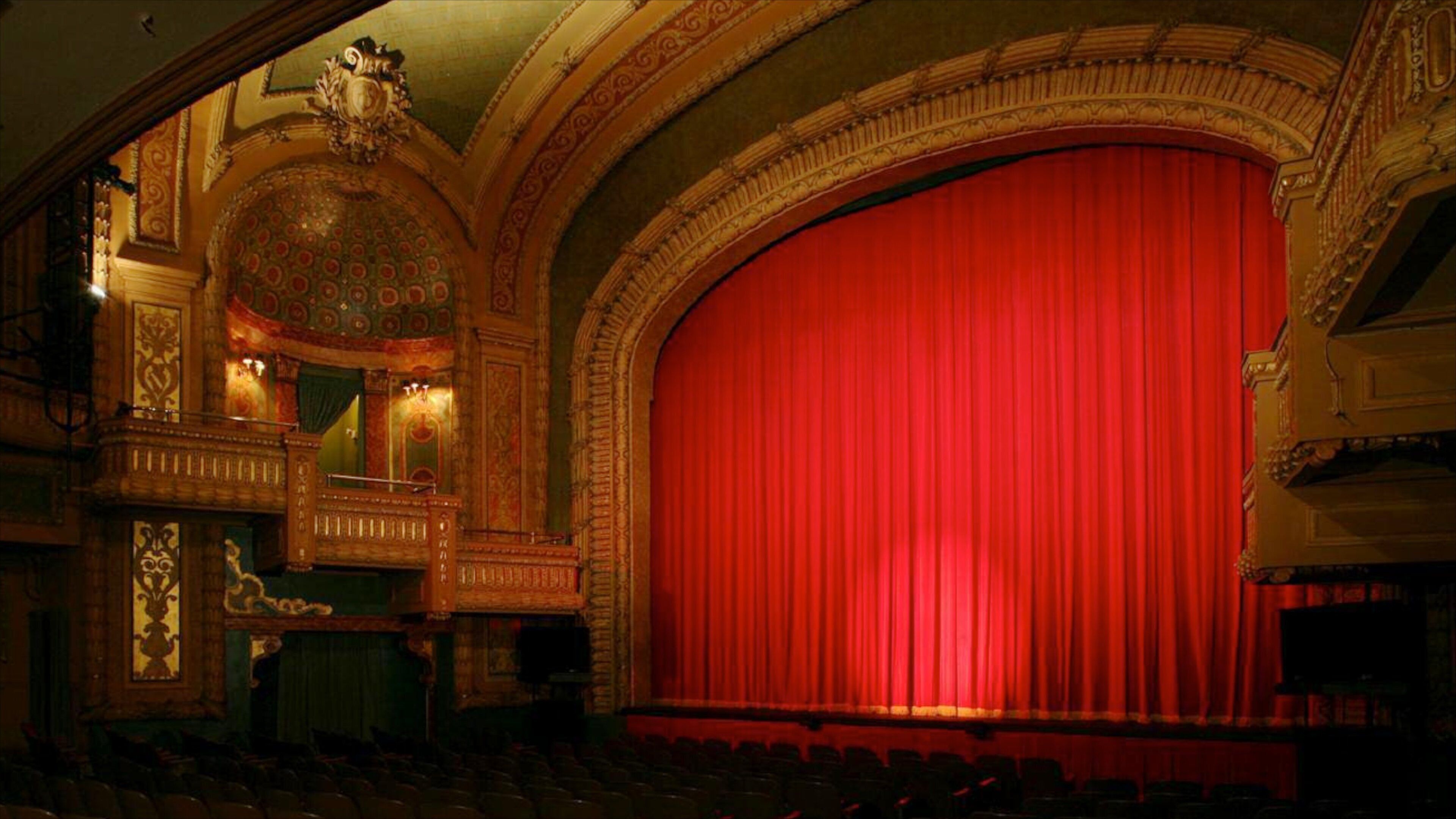 Historic performance space at Paramount Theatre in Austin, Texas features grand red curtain and ornate architecture