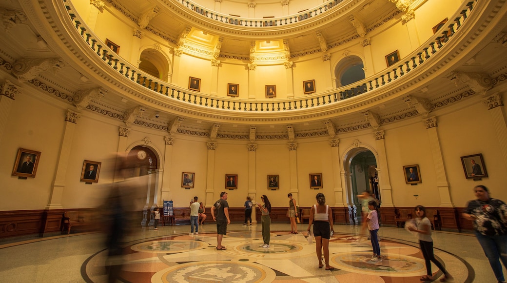 Texas State Capitol which includes heritage elements and interior views as well as a small group of people