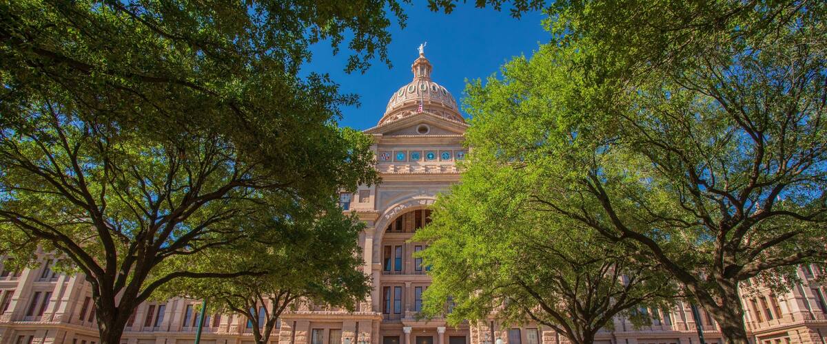 Texas State Capitol showing heritage architecture and an administrative buidling