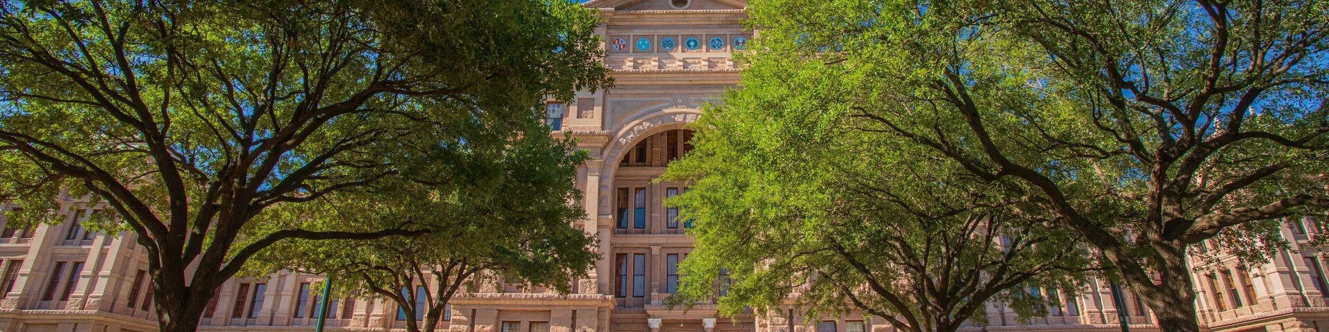 Texas State Capitol showing heritage architecture and an administrative buidling