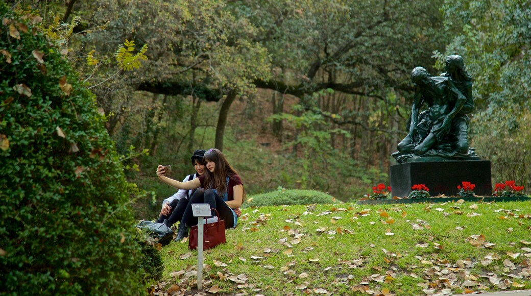 Umlauf Sculpture Garden and Museum showing a statue or sculpture and a garden as well as a couple