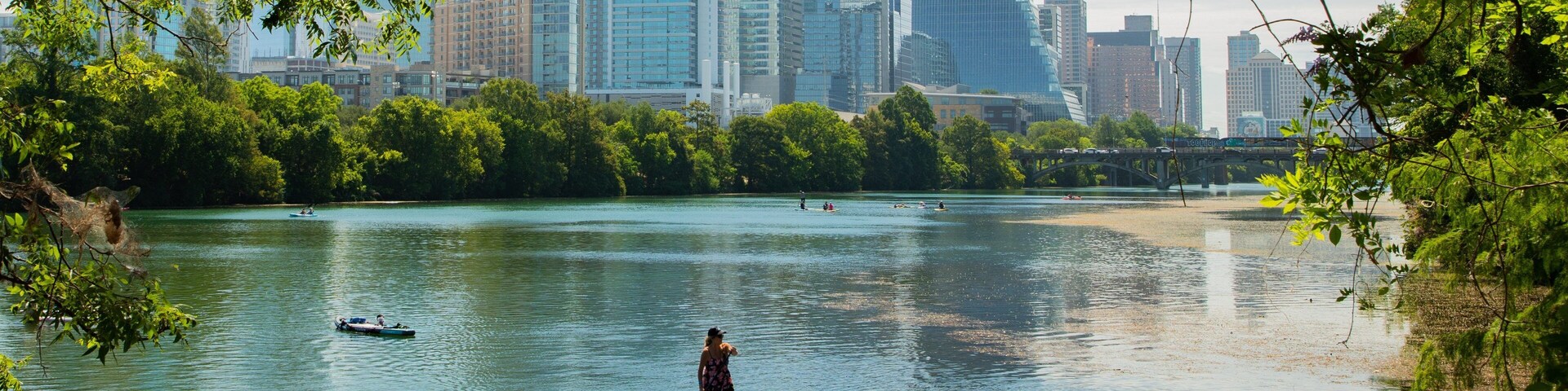 Zilker Park showing a bay or harbor and kayaking or canoeing