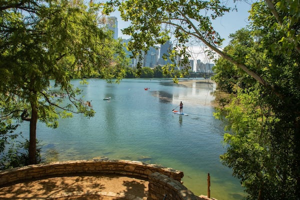 Zilker Park showing a bay or harbor and kayaking or canoeing