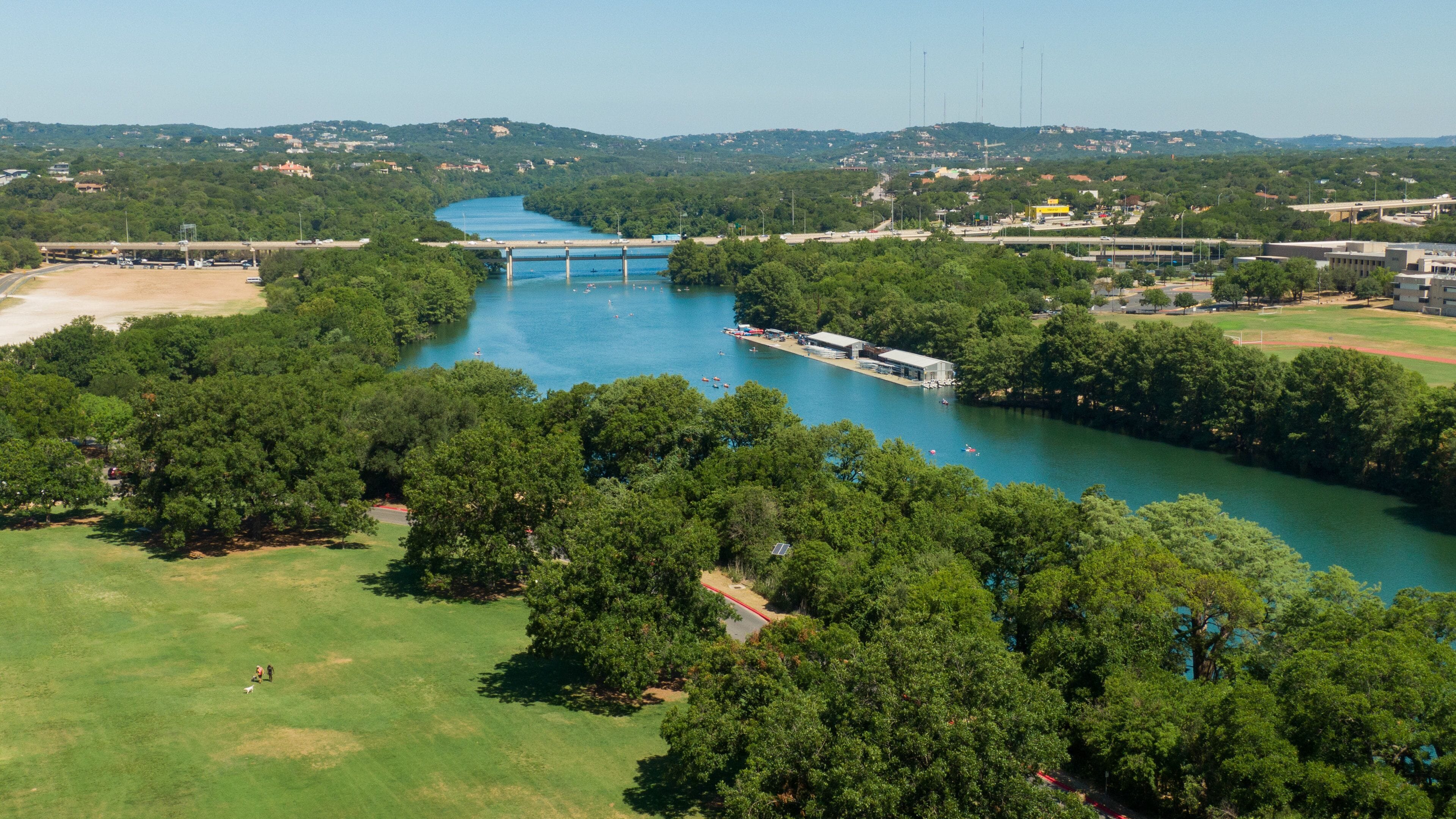 Zilker Park showing landscape views and a river or creek